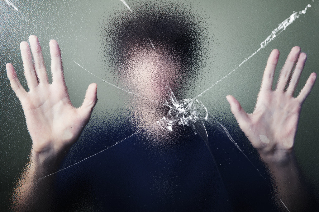 anonymous-man-with-cracked-glass-effect