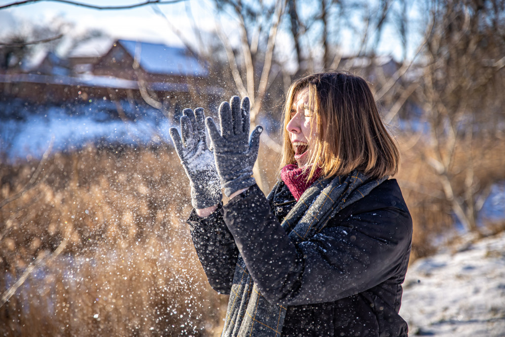 happy-young-woman-walk-winter-with-snow-her-hands